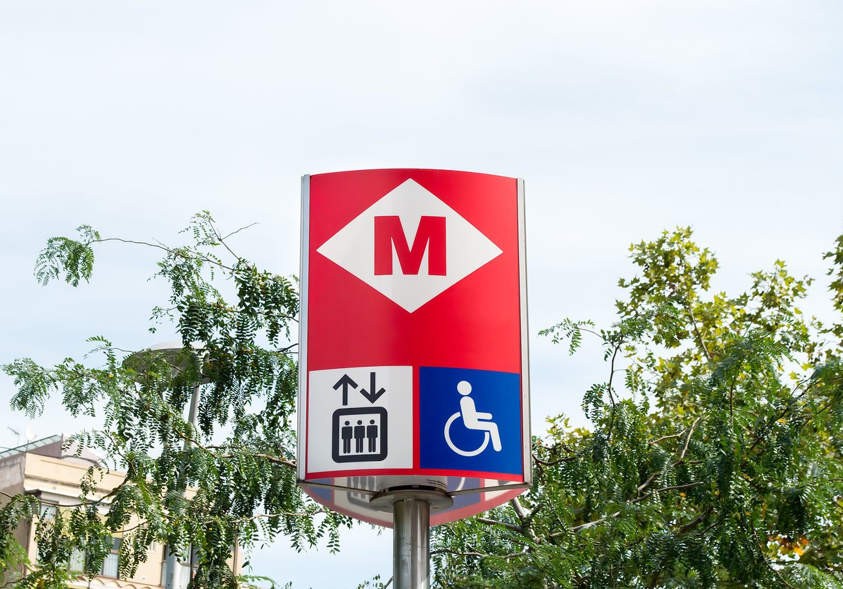 Barcelona metro sign indicating accessibility features, including an elevator and wheelchair access, highlighting the city's commitment to inclusive transportation.
