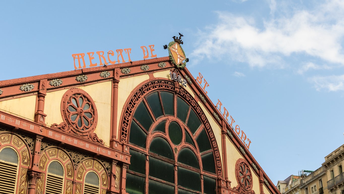 Close-up of the Mercat de Sant Antoni entrance in Barcelona, featuring its intricate design and "1882" inscription.