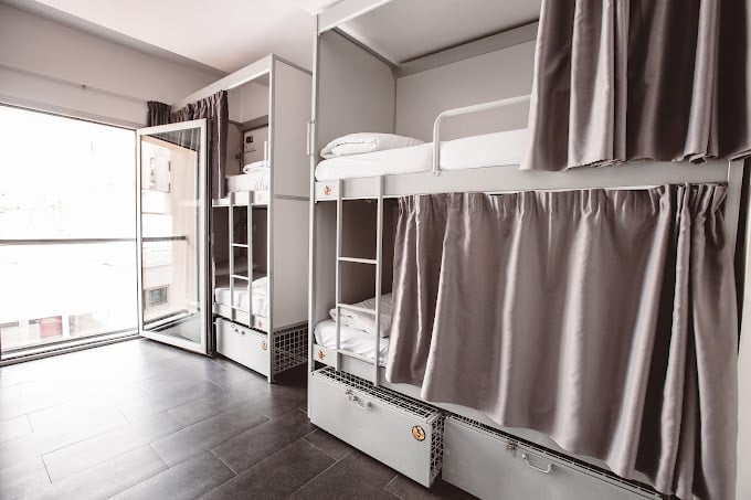 Bunk beds in a modern and spacious room at St. Christopher’s Inn in Barcelona.