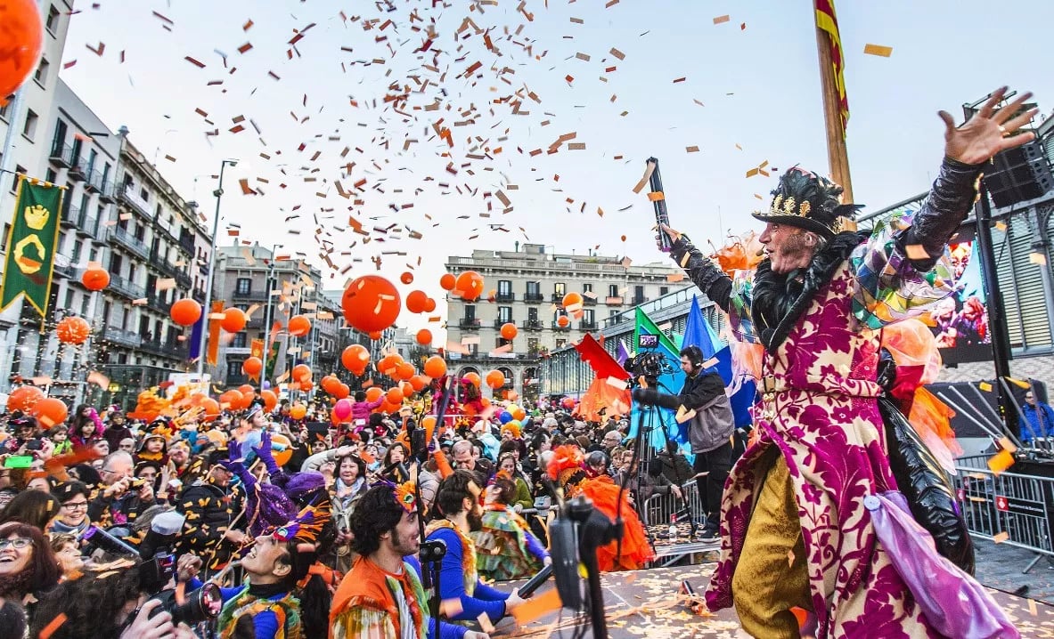 A vibrant celebration of Barcelona Carnival with colorful confetti and a lively crowd on the streets.